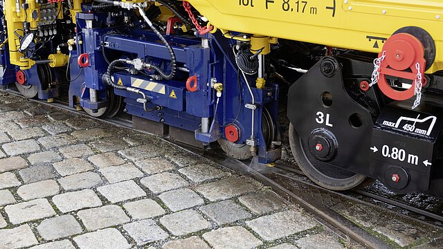 Plasser ATMO trailer performing urban rail grinding